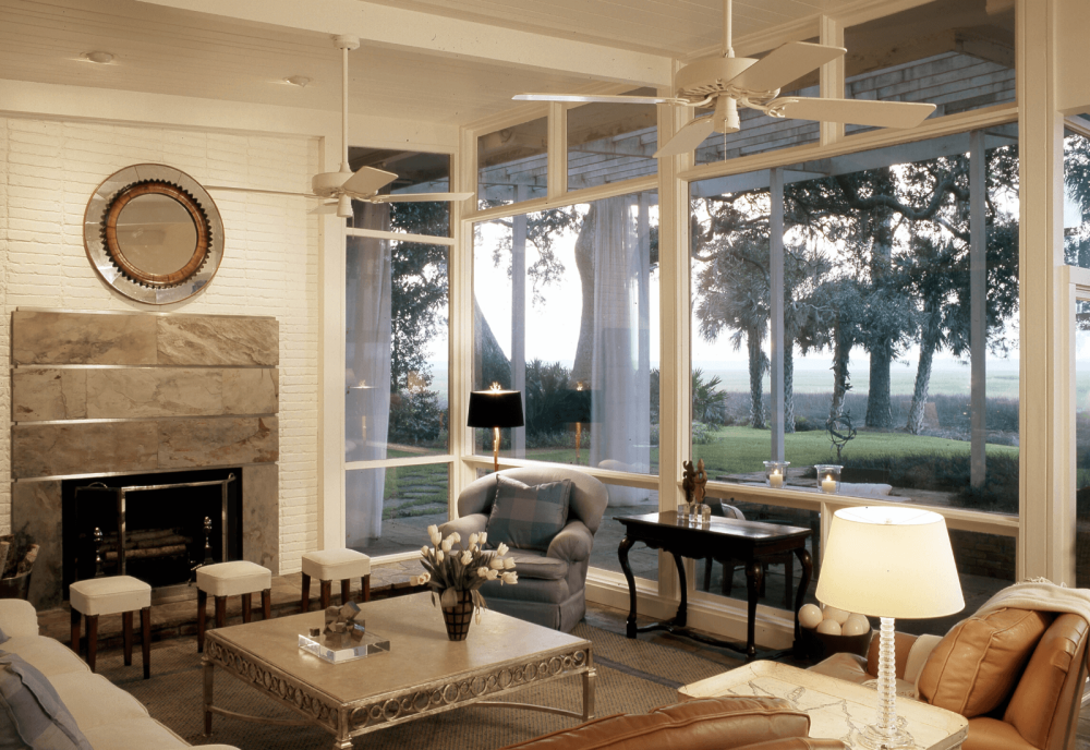 Living room with with glass walls overlooking marsh