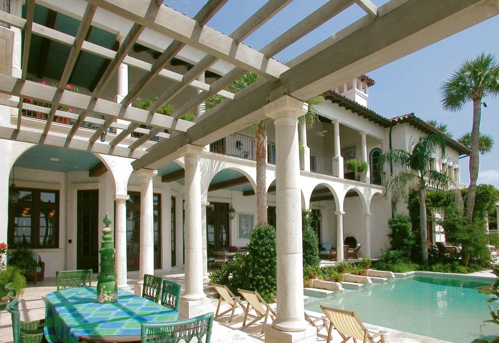 Outdoor pergola with arches and pool