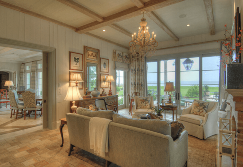 living room with beams overlooking ocean